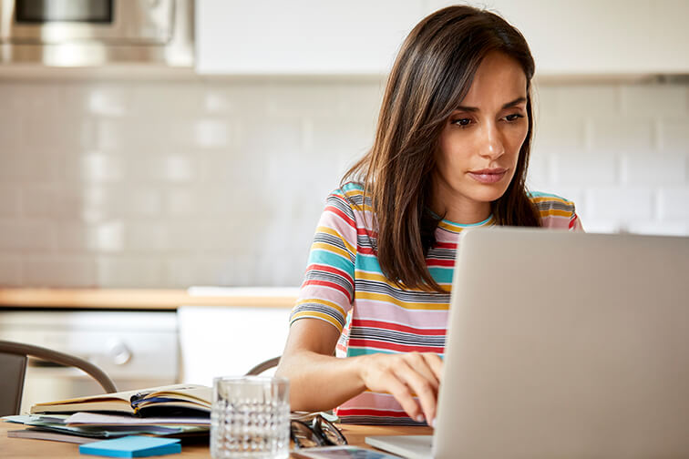 woman looking at her laptop