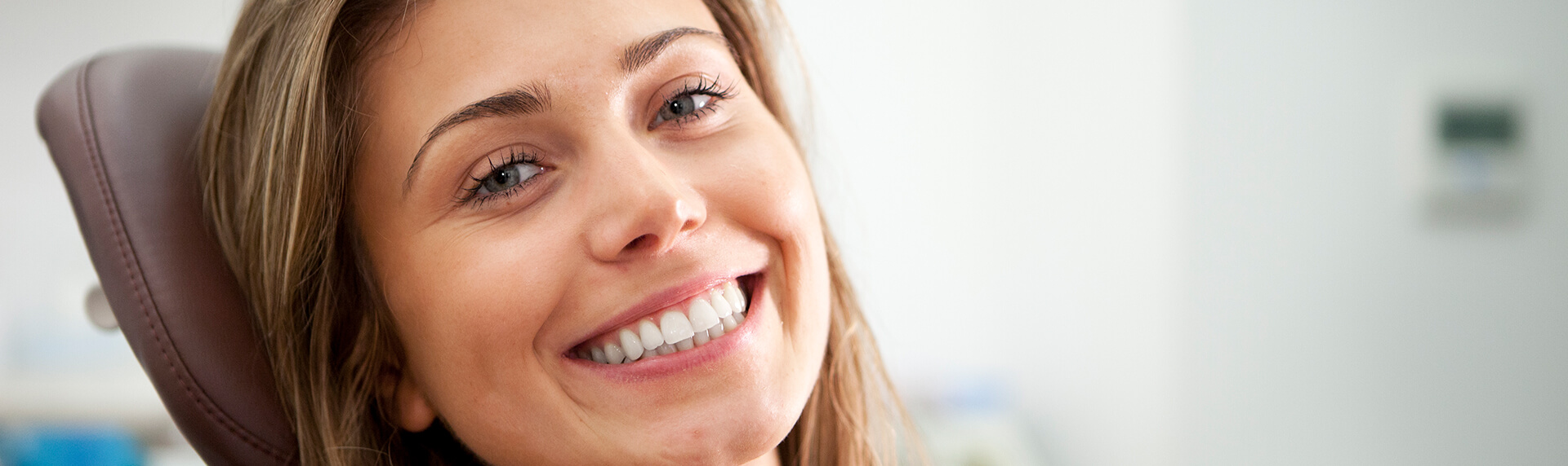 smiling woman sitting in a dental chair